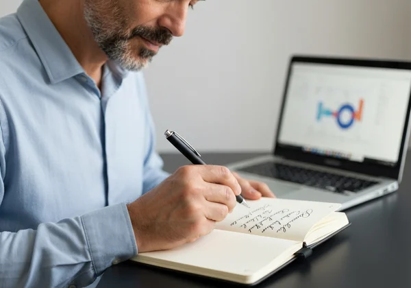 Person practicing elegant cursive handwriting