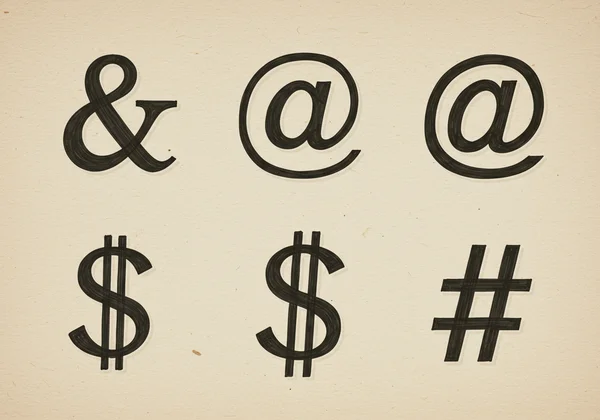 Examples of cursive ampersand, at sign, dollar, and hashtag.